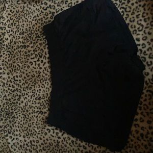 Black shorts and four shirts